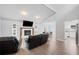 Bright living room featuring a fireplace, open floor plan, and seamlessly flowing into the kitchen at 3080 Cross Fox Dr, Mulberry, FL 33860