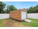 Newly constructed shed features a roll up door, ramp and a fenced backyard at 3080 Cross Fox Dr, Mulberry, FL 33860