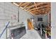 Unfinished basement providing ample storage and featuring exposed wood beams at 320 W Carver St, Lakeland, FL 33805