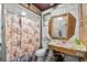 Retro bathroom with a unique sink, a shower, and charming vintage fixtures at 320 W Carver St, Lakeland, FL 33805