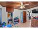 Charming bedroom showcasing a wood ceiling, tiled floors, and an open closet space at 320 W Carver St, Lakeland, FL 33805