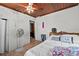 Bright bedroom with wood ceilings, tile floors, and a neutral color scheme at 320 W Carver St, Lakeland, FL 33805