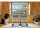 Close up of the kitchen sink that sits beneath a sunlit window at 320 W Carver St, Lakeland, FL 33805