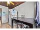 Simple kitchen area with a dining table set and a white refrigerator at 320 W Carver St, Lakeland, FL 33805