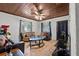 Cozy living room features tiled floors, wood ceilings, with comfortable seating arrangements at 320 W Carver St, Lakeland, FL 33805