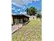 Backyard view of screened-in porch and detached garage at 355 Pico Ct, Lakeland, FL 33809