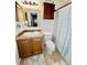 This bathroom offers a tile floor and shower with patterned curtain at 355 Pico Ct, Lakeland, FL 33809