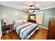 Comfortable bedroom with hardwood floors, ceiling fan, and a dresser at 355 Pico Ct, Lakeland, FL 33809