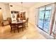 Bright dining area with wood floors and a sliding glass door to a patio at 355 Pico Ct, Lakeland, FL 33809
