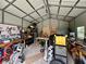 The garage has tools, workbenches, and lots of room for storage at 355 Pico Ct, Lakeland, FL 33809