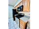 Modern kitchen with sleek black appliances and stylish countertop at 355 Pico Ct, Lakeland, FL 33809