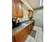 Well-lit kitchen featuring countertops, stainless steel sink, and tile flooring at 355 Pico Ct, Lakeland, FL 33809