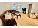 Spacious living room with a large sectional couch and hardwood flooring at 355 Pico Ct, Lakeland, FL 33809