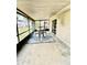 Enclosed patio offers an outside seating area and a ceiling with support beams at 355 Pico Ct, Lakeland, FL 33809