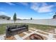 Spacious backyard featuring a lounge and fire pit on decorative stone, perfect for outdoor enjoyment at 3685 Diving Dove Ln, Bartow, FL 33830