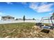 Expansive backyard featuring a seating area and a swing set, perfect for outdoor relaxation and recreation at 3685 Diving Dove Ln, Bartow, FL 33830