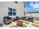Cozy backyard patio featuring modern outdoor seating and fire pit, ideal for relaxing and entertaining at 3685 Diving Dove Ln, Bartow, FL 33830