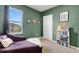 Cozy bedroom with natural light, green walls, and comfortable seating at 3685 Diving Dove Ln, Bartow, FL 33830