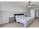 Neutral bedroom with bright white trim, plush carpet, ceiling fan, and a cozy feel at 3685 Diving Dove Ln, Bartow, FL 33830