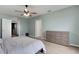 Airy bedroom offers access to two separate entrances, plenty of natural light, and a ceiling fan at 3685 Diving Dove Ln, Bartow, FL 33830