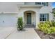 Charming front entrance with a covered porch and a well-maintained garden, adding curb appeal at 3685 Diving Dove Ln, Bartow, FL 33830