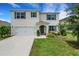 Charming two-story home with a well-manicured lawn and attached two car garage at 3685 Diving Dove Ln, Bartow, FL 33830