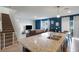 Open concept kitchen with granite countertops, island with sink and view of the living room at 3685 Diving Dove Ln, Bartow, FL 33830