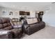Open-concept living area showcasing a modern kitchen and comfortable seating at 3685 Diving Dove Ln, Bartow, FL 33830