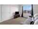 Bright living room with a gray couch, a TV, and a view from the window at 3685 Diving Dove Ln, Bartow, FL 33830
