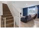 Cozy living room with staircase and comfortable seating at 3685 Diving Dove Ln, Bartow, FL 33830