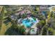 Aerial shot of community pool area, with uniquely designed pools, jacuzzi and meticulously landscaped grounds at 4124 Prima Lago Cir, Lakeland, FL 33810