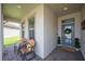 Cozy front porch with comfortable seating, offering a welcoming entrance to the home at 4124 Prima Lago Cir, Lakeland, FL 33810