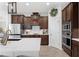 Elegant kitchen with stainless steel appliances, rich wood cabinets, and a spacious white countertop at 4124 Prima Lago Cir, Lakeland, FL 33810