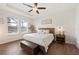Relaxing main bedroom with tray ceiling, two windows, and a neutral color scheme at 4124 Prima Lago Cir, Lakeland, FL 33810