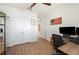 Office area with wooden floors, a ceiling fan, and an accent wall decor at 4124 Prima Lago Cir, Lakeland, FL 33810