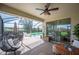 Inviting screened patio with a hanging chair and a partial view of the refreshing swimming pool at 4124 Prima Lago Cir, Lakeland, FL 33810