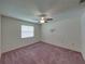 Bedroom with a fan and window that provides natural light, and carpeting at 4926 Pleasant Hollow Trl, Lakeland, FL 33811