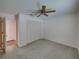 The bedroom features ample closet space with folding doors, neutral paint, and soft carpeting at 4926 Pleasant Hollow Trl, Lakeland, FL 33811