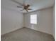 Neutral bedroom with carpet, fan, and window letting in natural light at 4926 Pleasant Hollow Trl, Lakeland, FL 33811
