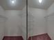 Inside the closet are white wire shelves to organize all of your clothes and belongings at 4926 Pleasant Hollow Trl, Lakeland, FL 33811