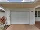 Exterior of garage featuring white door and house number 4926 at 4926 Pleasant Hollow Trl, Lakeland, FL 33811