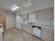 Functional kitchen featuring white appliances, essential amenities, and practical storage for everyday cooking needs at 4926 Pleasant Hollow Trl, Lakeland, FL 33811