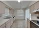 Well-lit kitchen featuring lots of counter space and essential appliances for functional meal preparation at 4926 Pleasant Hollow Trl, Lakeland, FL 33811