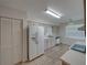Efficient kitchen layout with essential appliances and ample cabinet storage for functional meal preparation at 4926 Pleasant Hollow Trl, Lakeland, FL 33811