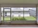 The screened-in back porch area of the home allows for a great view of the backyard's grassy lawn at 4926 Pleasant Hollow Trl, Lakeland, FL 33811
