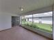 Enclosed screened porch perfect for relaxing in the breeze and enjoying peaceful views of the landscaped backyard at 4926 Pleasant Hollow Trl, Lakeland, FL 33811