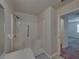 This accessible shower features grab bars, a built-in seat, and easy entry for safety and convenience at 4926 Pleasant Hollow Trl, Lakeland, FL 33811