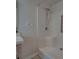 The shower features a shower head, a built-in seat and a chrome-colored grab bar at 4926 Pleasant Hollow Trl, Lakeland, FL 33811