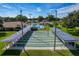 Overhead view of shuffleboard courts surrounded by lush green landscaping in a vibrant community at 4926 Pleasant Hollow Trl, Lakeland, FL 33811