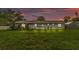 The backyard features a green lawn and outdoor seating at 5316 Forestbrook E Dr, Lakeland, FL 33811